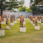 Grave Raiders Hit Nine States A memorial site with numerous sculptures and flowers in a grassy area