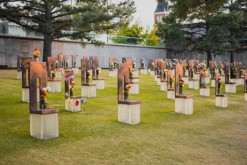 Oklahoma,City,,Ok,-,April,18,2022:,Flowers,And,Decorations A memorial site with numerous sculptures and flowers in a grassy area