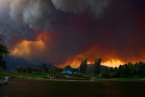 Wildfire,In,Kelowna,,British,Columbia,Canada,The,Forest,Is,On Dramatic sky filled with smoke and fire colors over a lake