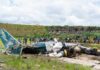 Thirteen Vanish On ‘Safe’ Scenic Hop Wreckage of a crashed airplane with emergency responders and onlookers