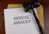 Hollywood Predator Hunt Explodes A court gavel resting on a document labeled 'SEXUAL ASSAULT'