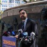 Mamdani’s Move Backfires — Feds Step In A man giving a speech at a podium in a city park