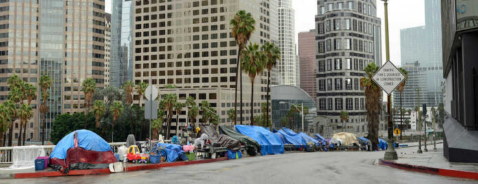 Street lined with tents and makeshift shelters downtown.