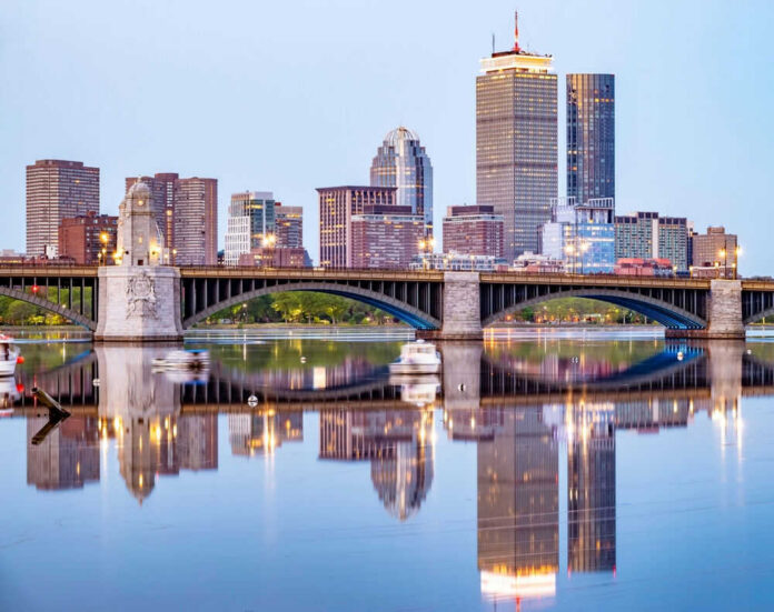 City skyline and bridge reflecting on calm water