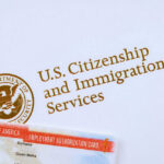 Blue States Rush Trump Rule Showdown U.S. Citizenship and Immigration Services logo with document.