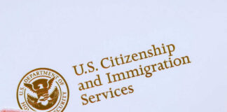 U.S. Citizenship and Immigration Services logo with document.