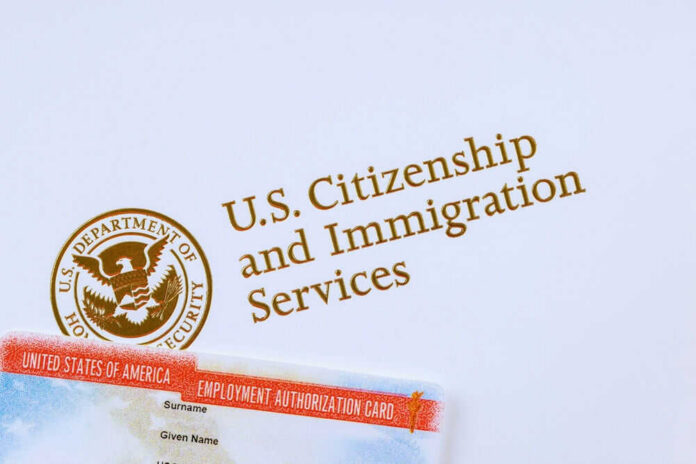 U.S. Citizenship and Immigration Services logo with document.