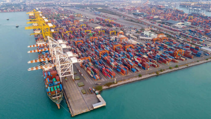 Aerial view of a busy shipping container port.