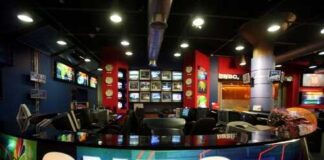 Interior of a CNBC news studio with multiple screens and a modern design