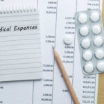 Medicare Moneyburn: $380M Vanishes On Human Organs? Notepad titled 'Medical Expenses' next to a calculator and medication